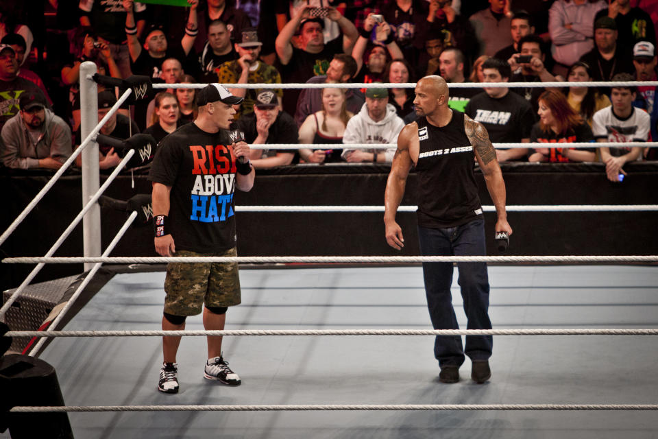 Dwayne Johnson, aka The Rock, enters the ring to talk about his upcoming opponent John Cena during the WWE Raw event at the Rose Garden Arena in Portland, Oregon on Monday, Feb. 27, 2012. (Photo by Chris Ryan/Corbis via Getty Pictures )