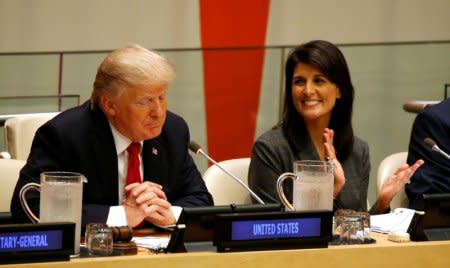 FILE PHOTO: U.S. Ambassador the the U.N. Nikki Haley applauds as U.S. President Donald Trump speaks during a session on reforming the United Nations at U.N. Headquarters in New York, U.S., September 18, 2017. REUTERS/Kevin Lamarque/File Photo