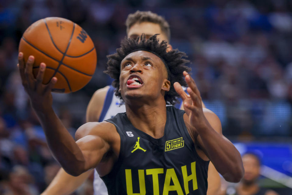 Utah Jazz point guard Collin Sexton, front, drives to the basket during the first half of an NBA basketball game against the Dallas Mavericks, Wednesday, Nov. 2, 2022, in Dallas. (AP Photo/Gareth Patterson)