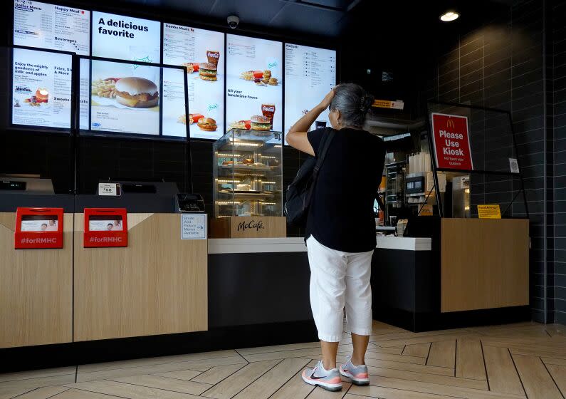 MIAMI, FLORIDA - JULY 26: A customer waits to order food at a McDonalds fast food restaurant on July 26, 2022 in Miami, Florida. The McDonald's company reported U.S. same-store sales rose 3.7%, while international sales rose 9.7% during the most recent quarter. However, it also said that total revenue fell 3% to $5.72 billion; it attributed the weakness to slowing demand in China. (Photo by Joe Raedle/Getty Images)