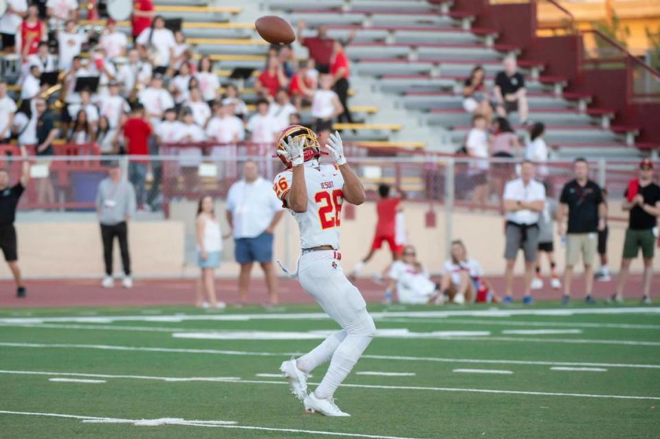 The Jesuit Marauders’ CJ Mealey (66) makes a catch to score a 66-yard touchdown in the first half of the Holy Bowl on Saturday at Sacramento City College.