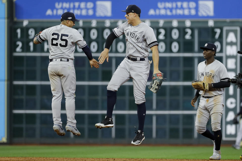 New York Yankees second baseman Gleyber Torres, left, and right fielder Aaron Judge celebrate after there win against the Houston Astros in Game 1 of baseball's American League Championship Series Saturday, Oct. 12, 2019, in Houston. (AP Photo/Matt Slocum)