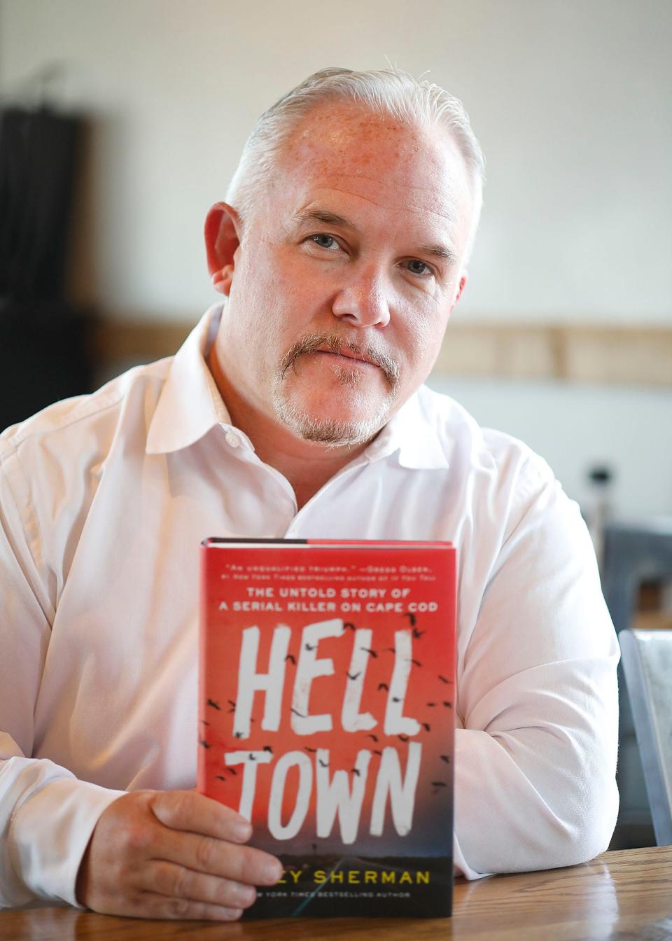 Marshfield author Casey Sherman with his new crime story, "Helltown," about a killer on Cape Cod. Thursday, June 30, 2022.