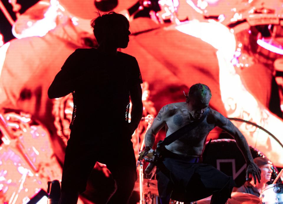 Red Hot Chili Peppers, comprising vocalist Anthony Kiedis, bassist Flea, drummer Chad Smith and guitarist John Frusciante, perform at Comerica Park in Detroit on Sunday, Aug. 14, 2022.