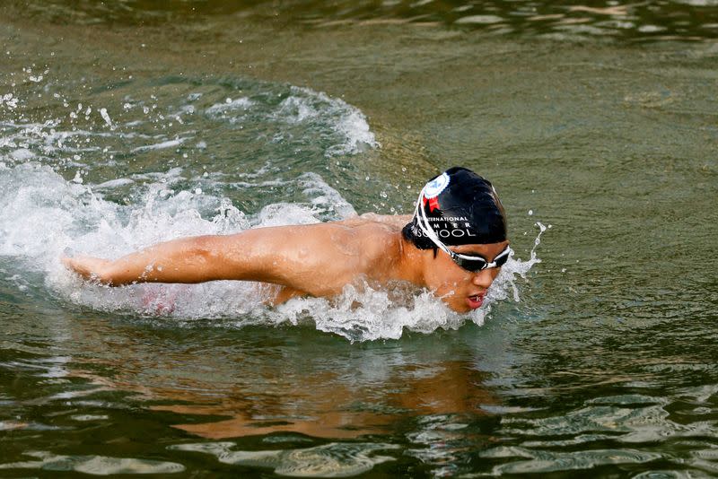 Competitive swimmer Jody Lee, 15, practices at Repulse Bay, in Hong Kong
