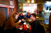 Customers inside the Apollo Pizzeria, in London, Britain, January 22, 2019. REUTERS/Henry Nicholls