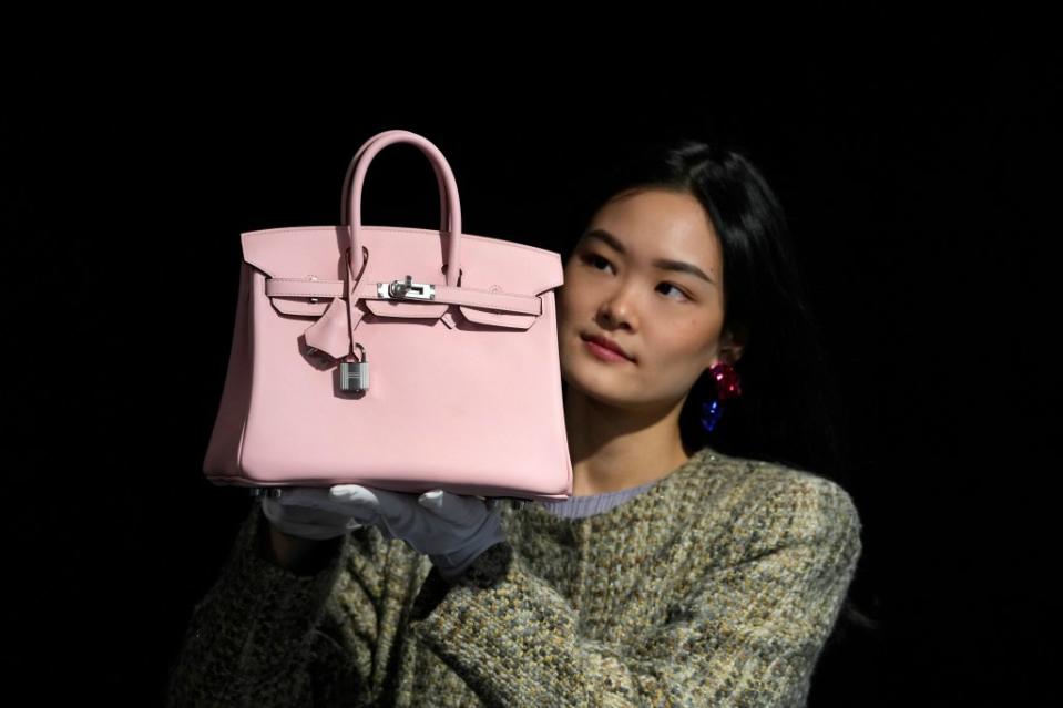 The lawsuit accused the luxury retailer of forcing customers to purchase other goods before given the opportunity to buy a Birkin. AP