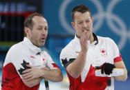 Curling - Pyeongchang 2018 Winter Olympics - Men's Bronze Medal Match - Switzerland v Canada - Gangneung Curling Center - Gangneung, South Korea - February 23, 2018 - Second Brent Laing of Canada and lead Ben Hebert of Canada talk during the match. REUTERS/John Sibley