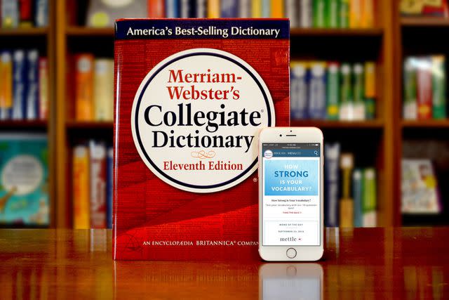 <p>Joanne K. Watson/Merriam-Webster via Getty</p> Merriam-Webster's Collegiate Dictionary and mobile website are displayed September 23, 2016 in Springfield, Massachusetts