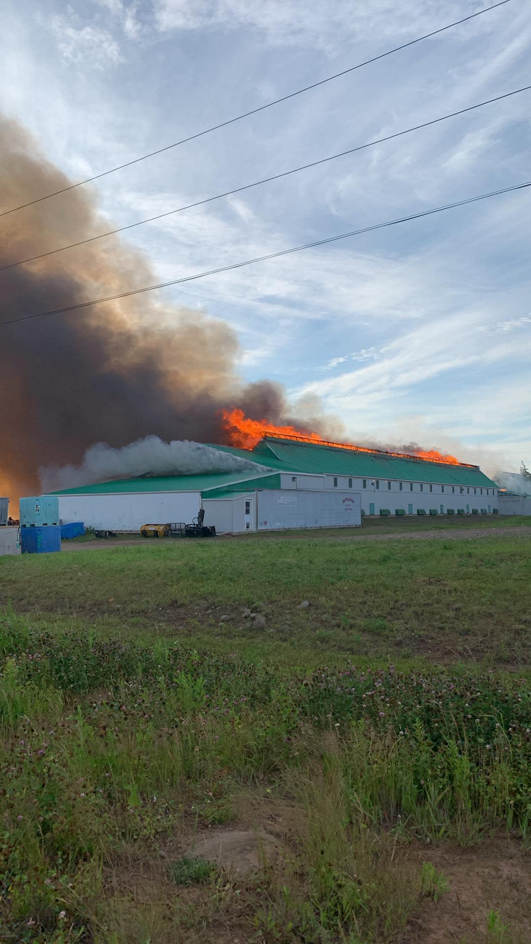 The Elphège & Norbert LeBlanc Ltd. smokehouse in Petit-Cap caught fire Tuesday morning. (Submitted to Radio-Canada - image credit)