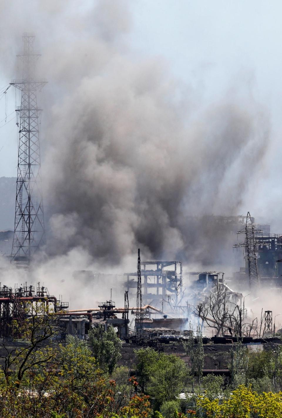 An explosion at a plant of Azovstal Iron and Steel Works during Ukraine-Russia conflict in the southern port city of Mariupol, Ukraine May 11, 2022. (REUTERS)