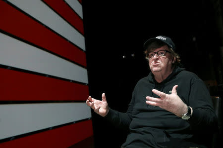 Michael Moore speaks during an interview at the site of his one-man Broadway show at the Belasco Theatre in Manhattan, New York, U.S., August 17, 2017. REUTERS/Shannon Stapleton