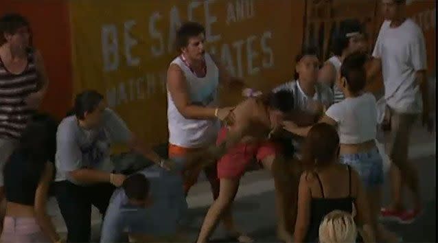 Schoolies break out into a massive brawl in the Gold Coast.
