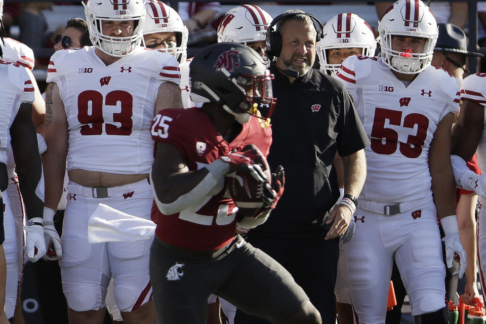 Washington State running back Nakia Watson (25) secures a pass during the first half of an NCAA college football game against Wisconsin, Saturday, Sept. 9, 2023, in Pullman, Wash. (AP Photo/Young Kwak)