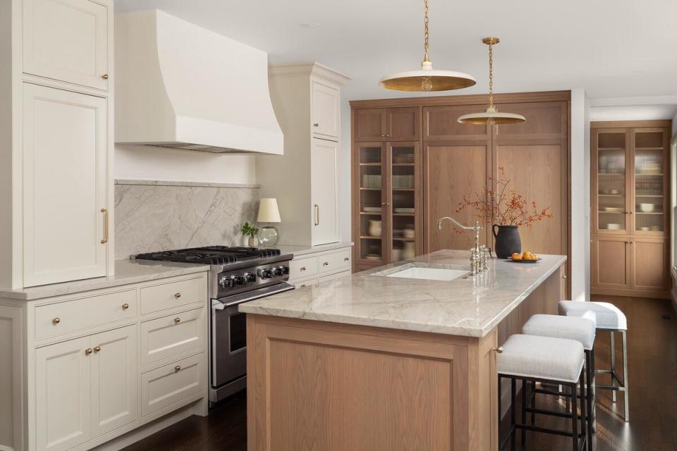 White oak, reeded glass and quartzite countertops are the foundation of a kitchen with soothing organic understones