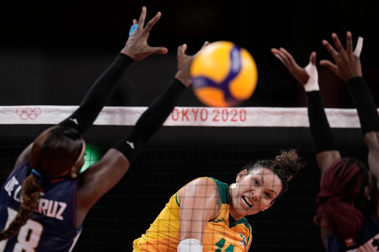 Brazil's Tandara Caixeta spikes a ball in a women's volleyball preliminary round pool A match against the Dominican Republic, at the 2020 Summer Olympics, Tuesday, July 27, 2021, in Tokyo, Japan.