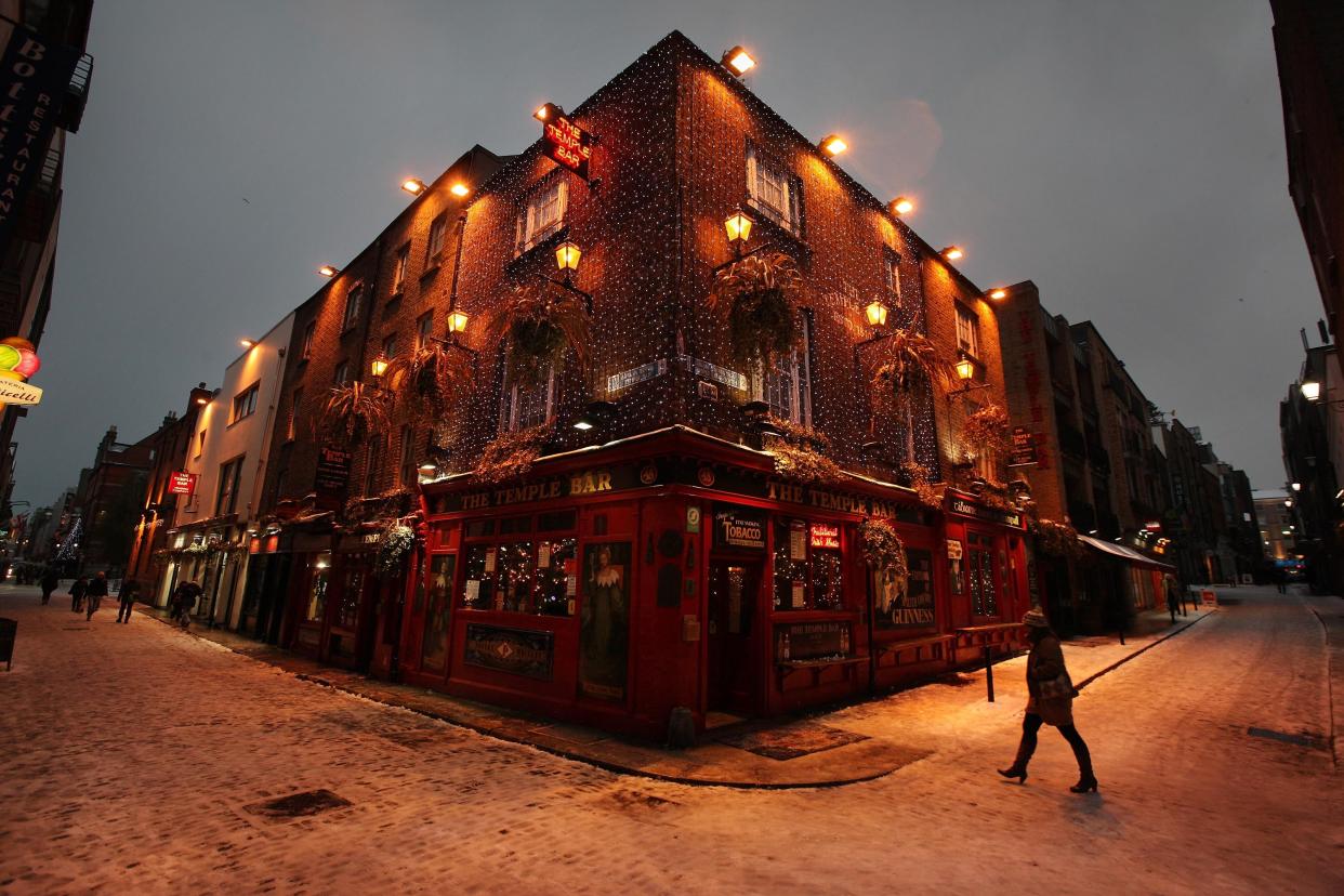 The Temple Bar pub in Dublin is swathed in Christmas decorations  (Getty Images)