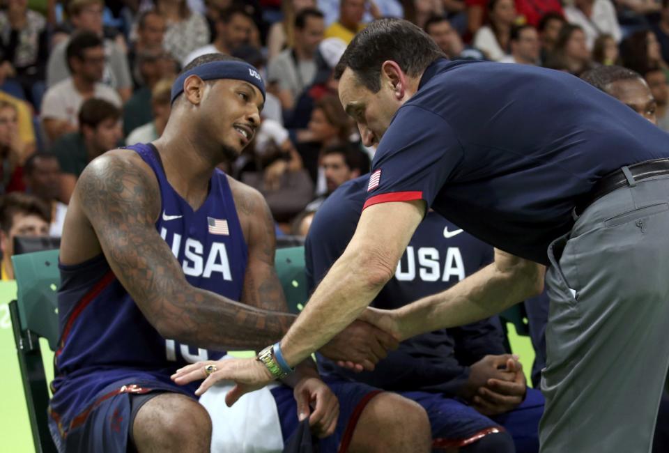 Team USA coach Mike Krzyzewski congratulates Carmelo Anthony near the end of the game. (Reuters)