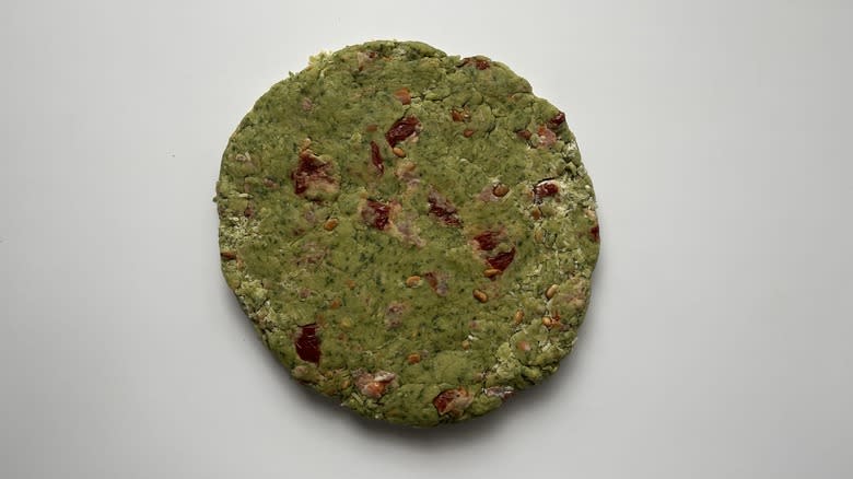 flat round of green dough