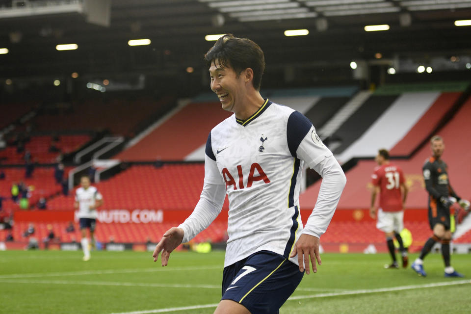 Tottenham's Son Heung-min celebrates after scoring his side's fourth goal during the English Premier League soccer match between Manchester United and Tottenham Hotspur at Old Trafford in Manchester, England, Sunday, Oct. 4, 2020. (Oli Scarff/Pool via AP)