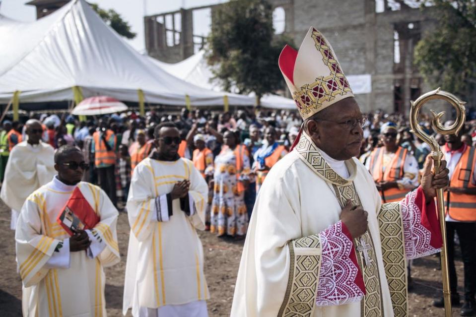 Congolese Cardinal Fridolin Ambongo (R) parades before attending a mass for peace in Goma, eastern Democratic Republic of Congo, on January 28, 2024. A mass for peace in the Great Lakes region was organized by representatives of the Catholic churches of the DRC, Rwanda and Burundi, where Congolese Cardinal Fridolin Ambongo criticized the leaders of the three countries, accusing them of inciting "division and war". Armed clashes involving the armies of the three countries have been taking place in eastern Congo for several months, resulting in hundreds of deaths and hundreds of thousands of displaced persons