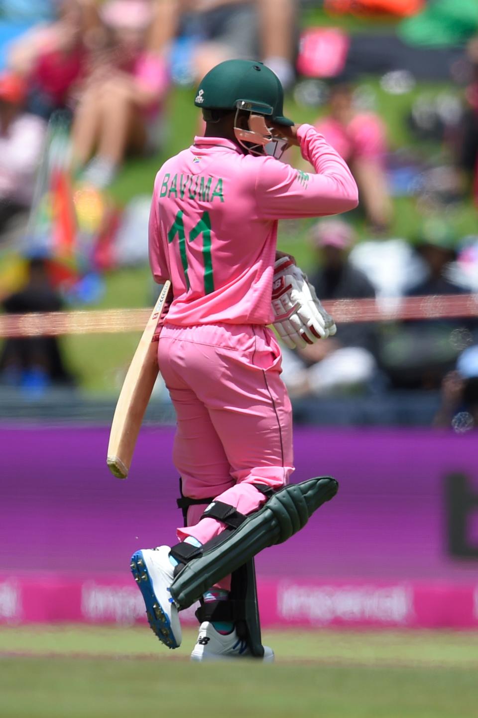 South Africa's Temba Bavuma walks back to the pavilion after his dismissal by England's Adil Rashid during the third one day international (ODI) cricket match between South Africa and England at the Wanderers Stadium in Johannesburg on February 9, 2020. - The South African team and the wickets are in pink to raise awareness for breast cancer. (Photo by Christiaan Kotze / AFP) (Photo by CHRISTIAAN KOTZE/AFP via Getty Images)