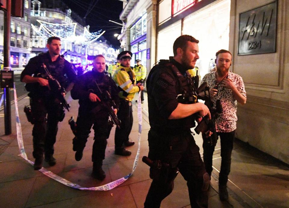 Armed Police rush to the scene (EPA)