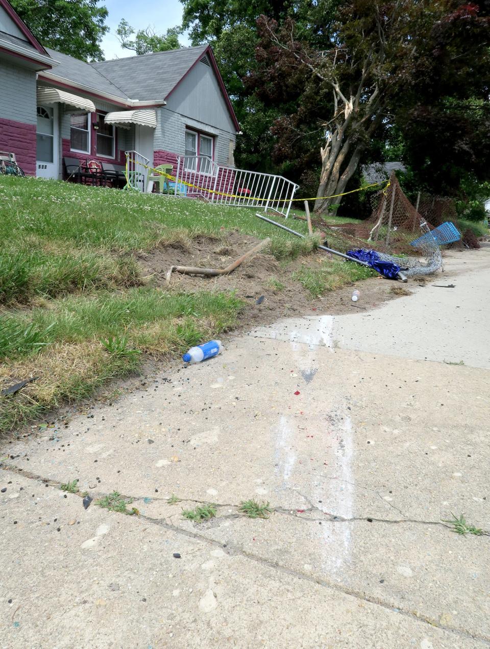 A damaged fence and railing are remnants of a chase by the Asbury Park Police Department Sunday evening of a vehicle leaving the scene of a shots fired incident in their town ended with the car crashing at 527 Myrtle Avenue in Neptune.  Patrol units responding to gunfire coming from the 10 block of Atkins Avenue spotted a vehicle leaving the area and attempted to initiate a traffic stop, with the car crashing less than a mile away into the front yard of the home shown Tuesday, June 7, 2022.