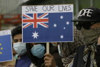 In this Friday, April 30, 2021, photo former Afghan interpreters hold placards during a protest against the U.S. government and NATO in Kabul, Afghanistan. (AP Photo/Mariam Zuhaib)