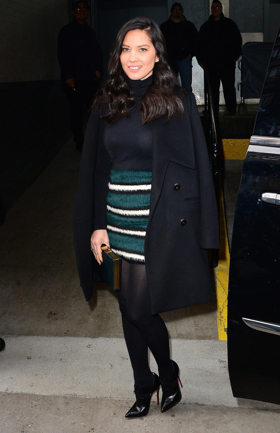 Olivia Munn In All Black with a Striped Skirt in New York City