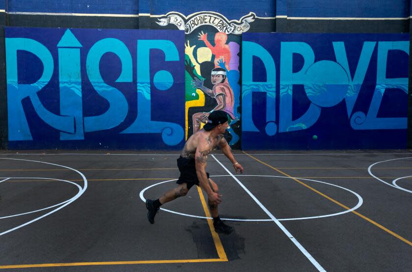 Santa Barbara, CA - September 28: Adrian Campos plays handball in Bonhett Park against a mural on Thursday, Sept. 28, 2023, in Santa Barbara, CA. (Francine Orr / Los Angeles Times)