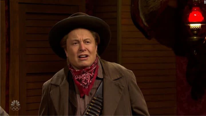 Elon Musk dressed as a cowboy in a Saturday Night Live sketch.