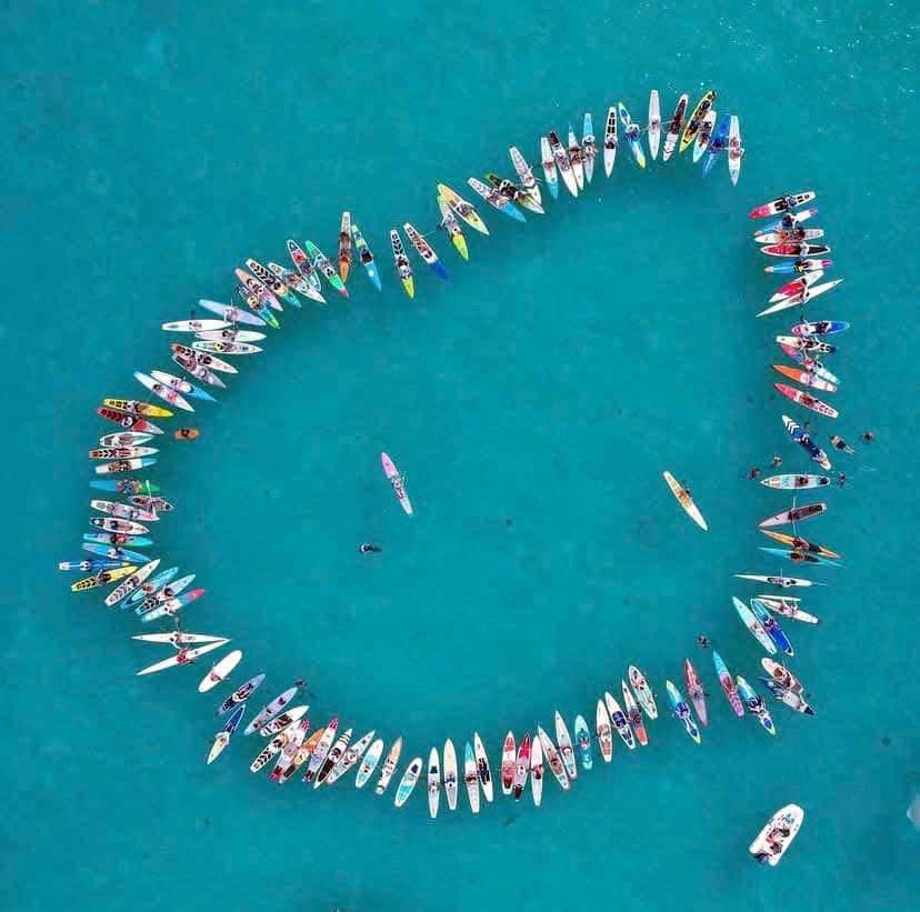 Participants in last month's 2022 Crossing For Cystic Fibrosis challenge are pictured on their paddle boards in this aerial photograph. Destin firefighter and EMT Holly Heidenreich and her teammate, Megan Scully from Lake Worth, paddled 80 miles from Bimini, Bahamas to the mainland of Florida in the event, which raises funds for and brings attention to those living with cystic fibrosis.