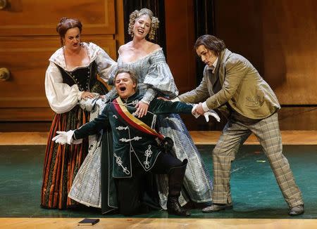 Singers (L-R) Monika Bohinec as Magdalena, Anna Gabler as Eva, Roberto Sacca as Walther von Stolzing and Peter Sonn as David perform on stage during a dress rehearsal of Richard Wagner's opera "Die Meistersinger von Nuernberg" in Salzburg in this July 29, 2013 file photo. REUTERS/Dominic Ebenbichler/Files