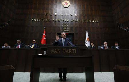 Turkey's Prime Minister Tayyip Erdogan addresses members of parliament from his ruling AK Party (AKP) during a meeting at the Turkish parliament in Ankara February 25, 2014. REUTERS/Umit Bektas