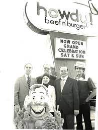 Reopening celebration at Howdy Beef n' Burger in 1976. From left, state Sen. Arthur Tobin, district sales manager Bill Daly, Mel Weman and his wife, and manager Tom Leone.