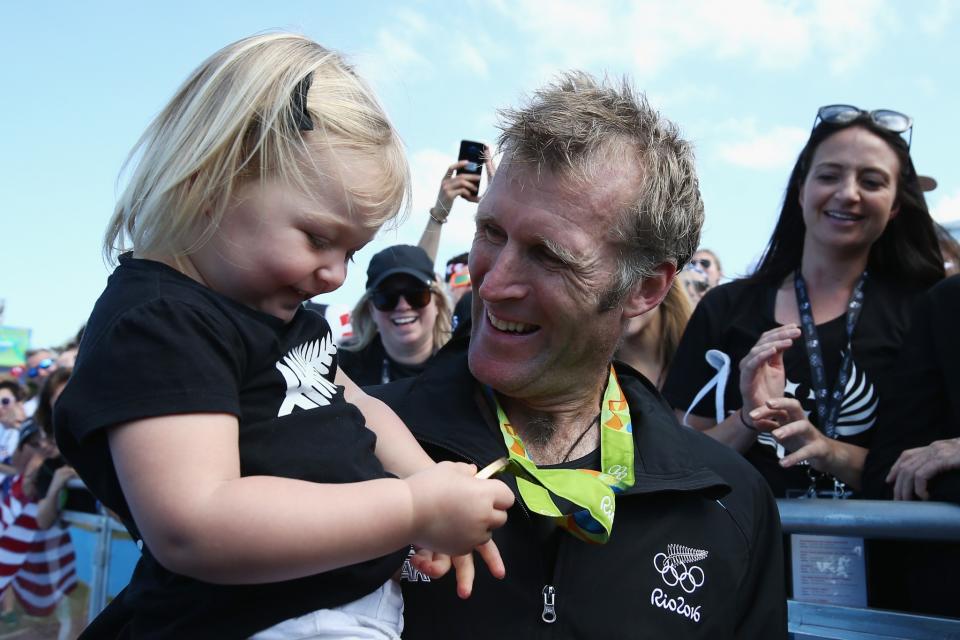 <p>Gold medalist Mahe Drysdale of New Zealand celebrates with his daughter Bronte after the medal ceremony for the Men’s Single Sculls on Day 8 of the Rio 2016 Olympic Games at the Lagoa Stadium on August 13, 2016 in Rio de Janeiro, Brazil. (Photo by Buda Mendes/Getty Images) </p>