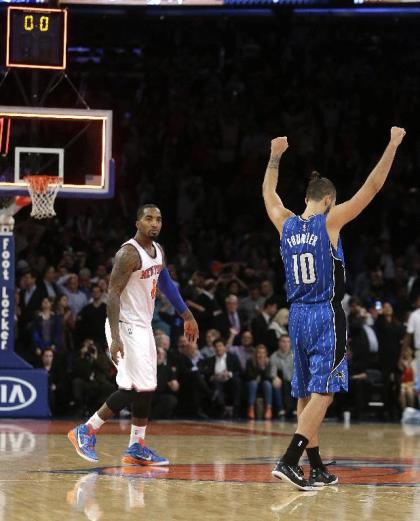 Evan Fournier celebrates J.R. Smith's miss. (AP)