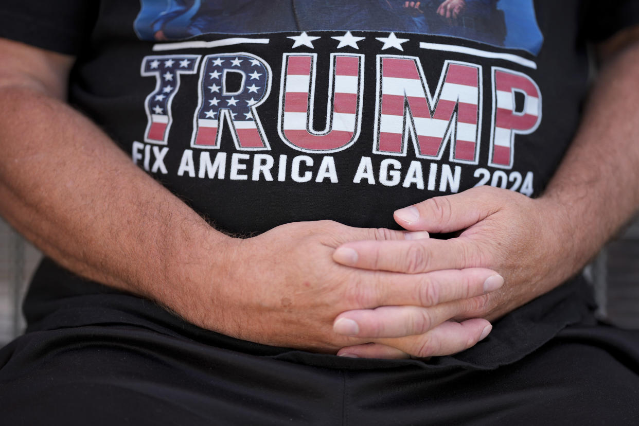 Joseph Wiederien wears a Republican presidential nominee former President Donald Trump t-shirt as he speaks during an interview with The Associated Press, Friday, Sept. 6, 2024, in Des Moines, Iowa. (AP Photo/Charlie Neibergall)