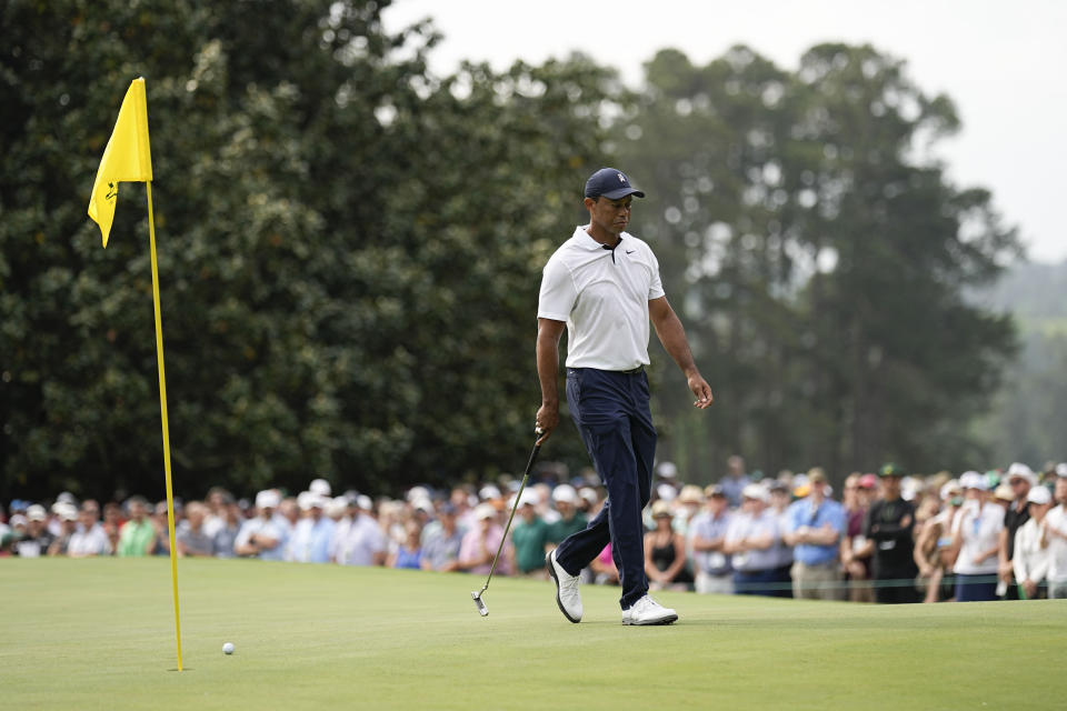 Tiger Woods lines up a putt on the first hole during the first round of the Masters golf tournament at Augusta National Golf Club on Thursday, April 6, 2023, in Augusta, Ga. (AP Photo/David J. Phillip)
