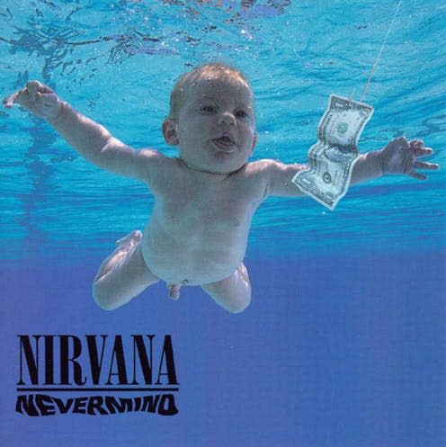 <span class="caption">Baby chasing the dollar on the cover of Nirvana's Nevermind.</span> <span class="attribution"><a class="link " href="https://www.alamy.com/nirvana-nevermind-vintage-cover-album-image237149651.html?pv=1&stamp=2&imageid=AEB0BD10-B6DD-4831-A344-3F27122C287A&p=716199&n=0&orientation=0&pn=1&searchtype=0&IsFromSearch=1&srch=foo%3dbar%26st%3d0%26pn%3d1%26ps%3d100%26sortby%3d2%26resultview%3dsortbyPopular%26npgs%3d0%26qt%3dnirvana%2520nevermind%26qt_raw%3dnirvana%2520nevermind%26lic%3d3%26mr%3d0%26pr%3d0%26ot%3d0%26creative%3d%26ag%3d0%26hc%3d0%26pc%3d%26blackwhite%3d%26cutout%3d%26tbar%3d1%26et%3d0x000000000000000000000%26vp%3d0%26loc%3d0%26imgt%3d0%26dtfr%3d%26dtto%3d%26size%3d0xFF%26archive%3d1%26groupid%3d%26pseudoid%3d1223304%26a%3d%26cdid%3d%26cdsrt%3d%26name%3d%26qn%3d%26apalib%3d%26apalic%3d%26lightbox%3d%26gname%3d%26gtype%3d%26xstx%3d0%26simid%3d%26saveQry%3d%26editorial%3d%26nu%3d%26t%3d%26edoptin%3d%26customgeoip%3dGB%26cap%3d1%26cbstore%3d1%26vd%3d0%26lb%3d%26fi%3d2%26edrf%3d%26ispremium%3d1%26flip%3d0%26pl%3d" rel="nofollow noopener" target="_blank" data-ylk="slk:Alamy;elm:context_link;itc:0;sec:content-canvas">Alamy</a></span>