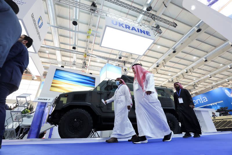 Saudi men are seen walking in front of Ukrainian stand displaying the latest defense system at World Defense Show in Riyadh, Saudi Arabia