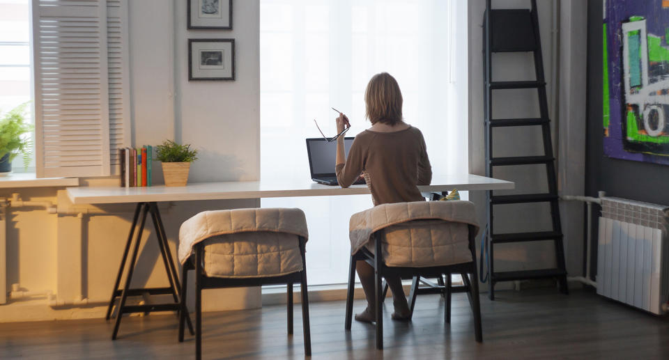 Woman sits in front of a computer. Source: Getty Images