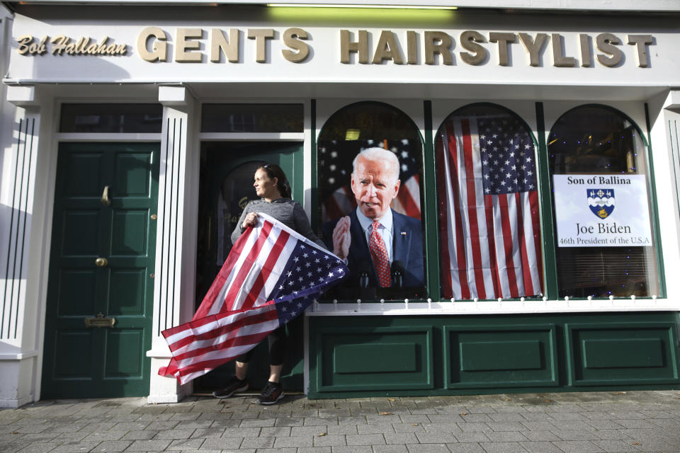 Catherine Hallahan waits for the celebrations to start in Ballina, North West of Ireland Saturday, Nov. 7, 2020. Ballina is the ancestral home of US Presidential candidate Joe Biden. (AP Photo/Peter Morrison)