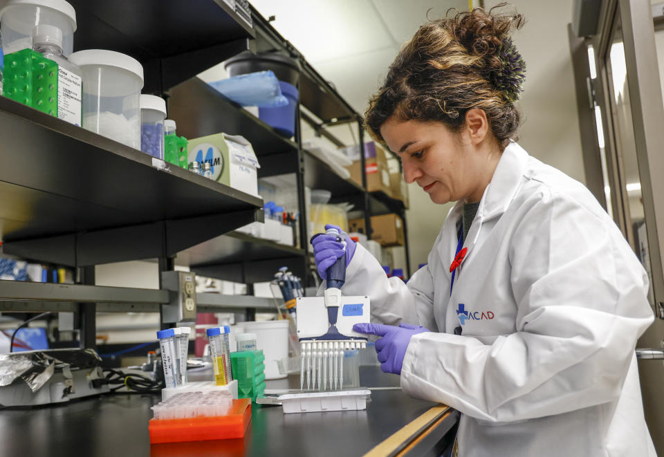 Research assistant Yeganeh Khaniani handles samples at a lab in the Alberta Centre for Advanced Diagnostics, a new hub in the global push to advance diagnostic technology for healthcare, in Calgary, Alta., Monday, Nov. 7, 2022.THE CANADIAN PRESS/Jeff McIntosh