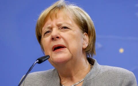 German Chancellor Angela Merkel holds a press conference at the end of the second day of the European Council summit in Brussels, Belgium, 13 December - Credit: JULIEN WARNAND/EPA-EFE/REX