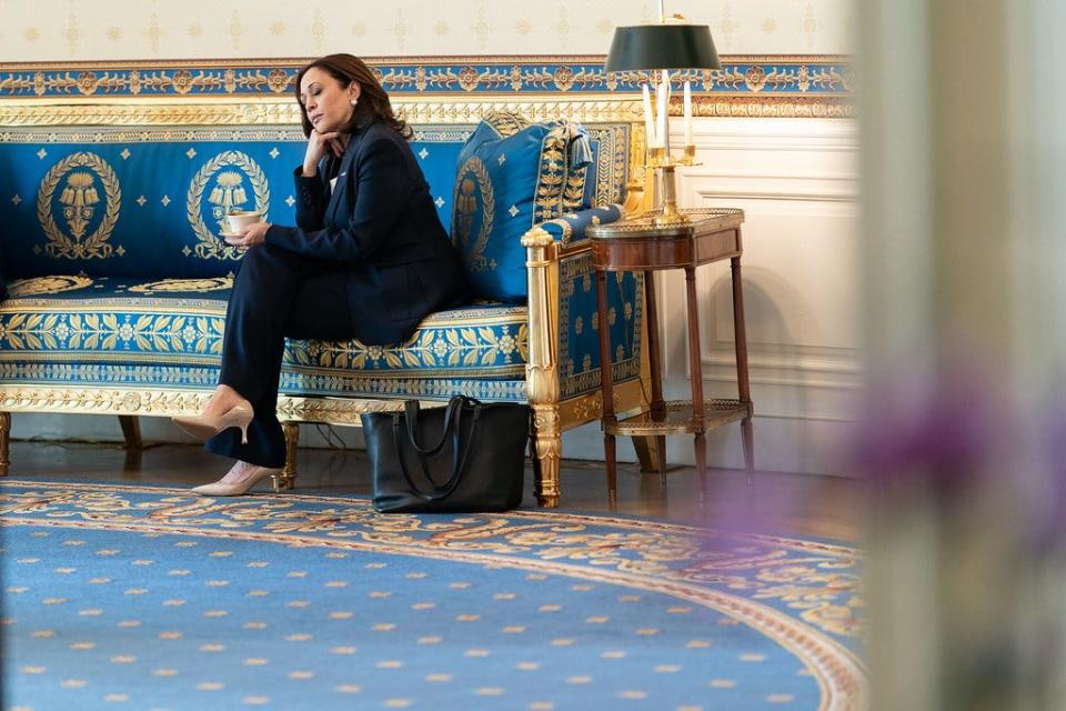 Vice President Kamala Harris sits in the East Room