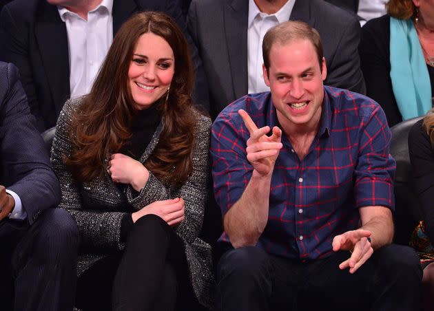 The two sitting courtside in 2014. 