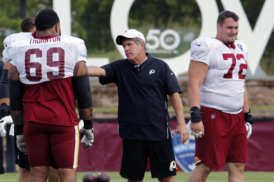 Washington interim head coach Bill Callahan, center, said rookie Dwayne Haskins isn't a candidate to start the team's next game. (AP) 