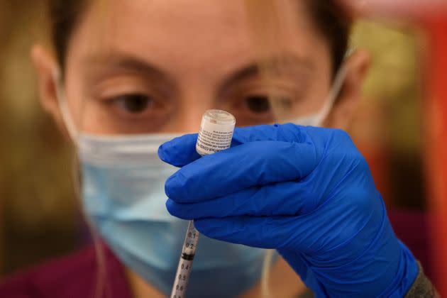 A health care worker prepares a dose of the Pfizer COVID-19 vaccine. The vaccine was the first to achieve full authorization from the FDA.  (Photo: PATRICK T. FALLON via Getty Images)